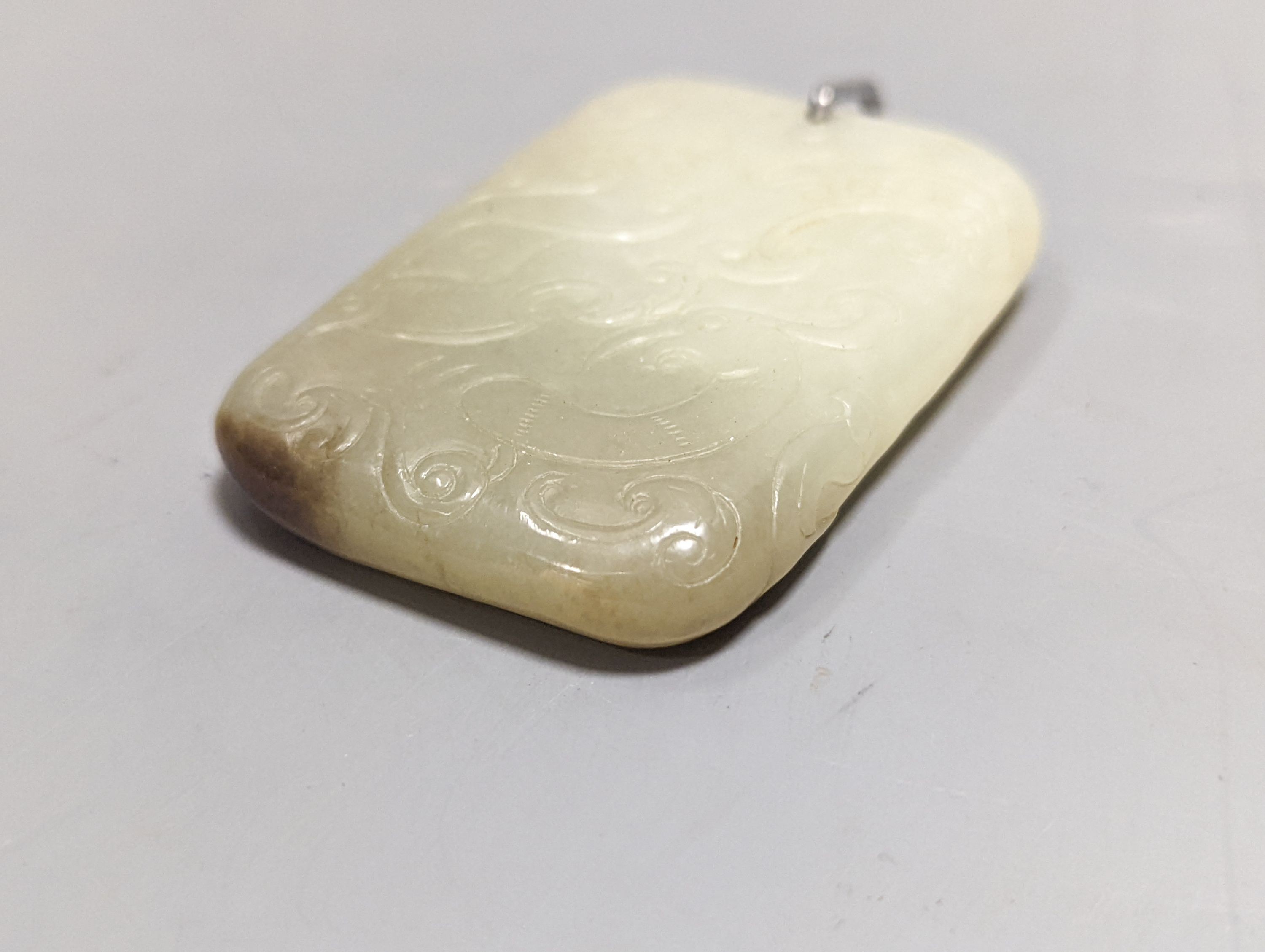 A Chinese carved jade plaque 6.5cm